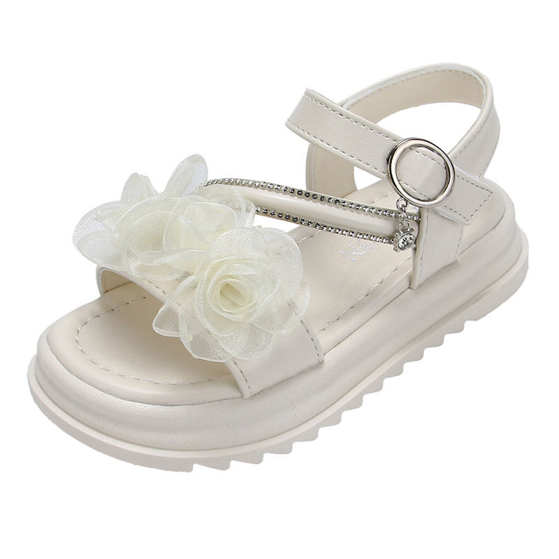 Niñas sandalias de suela suave 2026 verano de moda para niños zapatos de playa versátiles flores huecos zapatos de dedo abierto