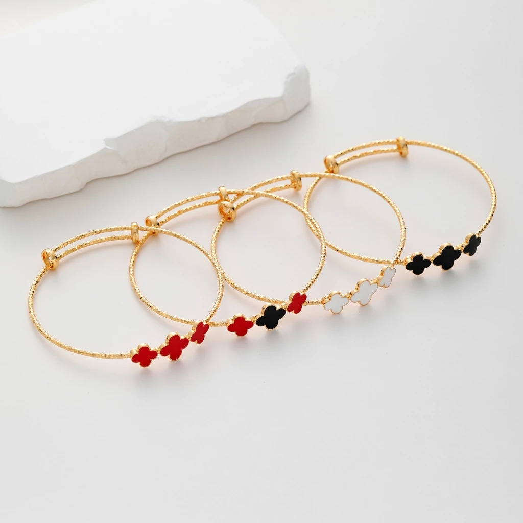 Pulsera de trébol de cuatro hojas con goteo de oro champán chapado en cobre, pulsera de personalidad simple para mujer, boca de anillo de mano ajustable, estilo clásico al por mayor