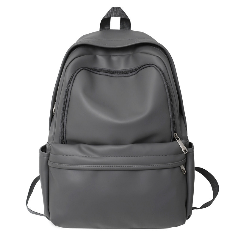 Comercio exterior nuevo estilo cuero suave gran capacidad color sólido escuela de secundaria mochila de moda masculina todo fósforo mochila simple japonesa