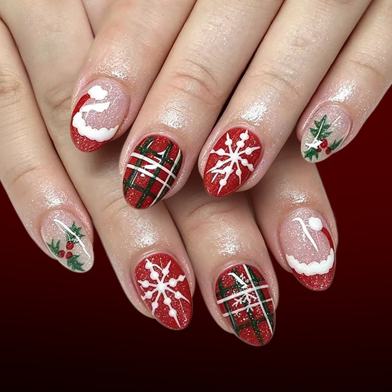 Short oval nails with a glossy French finish, featuring Christmas hats, snowflakes, red and green plaid patterns, green leaves, and red berries, 24 pieces of Christmas press-on nails Short oval nails with a glossy French finish, featuring Christmas hats, snowflakes, red and green plaid patterns, green leaves, and red berries, 24 pieces of Christmas press-on nails