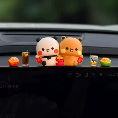 Car ornaments | the car's center console - get-rich-quick-with-these-two-decorative-orange-figurines-plus-american-coffee-lemon-tea-and-a-free-pack-of-adhesive-strips
