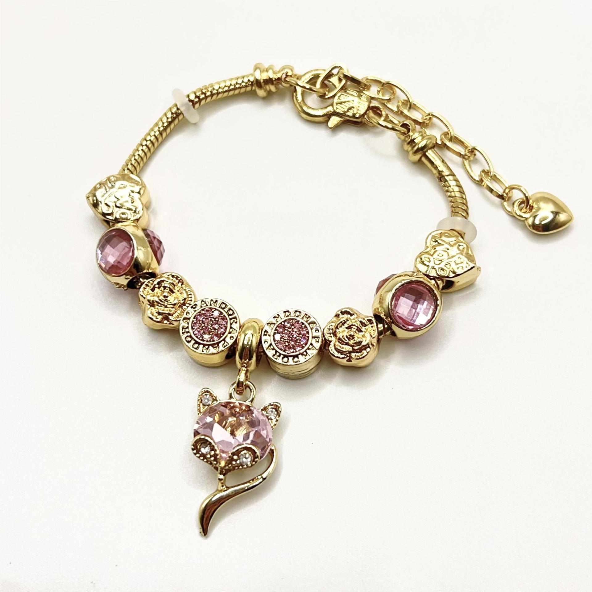 春夏の新型の小清新で甘い少女風のストライプの花の愛の蝶の数珠のブレスレットの透かし彫りのダイヤモンドの手の串