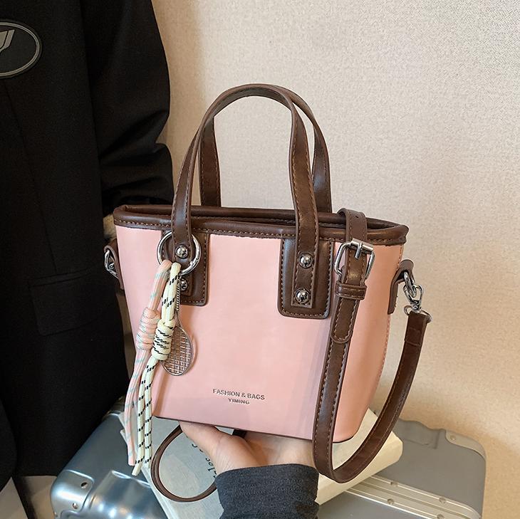 Bolso de mano de alta gama de nicho para mujer 2025 nuevo bolso de hombro de todo fósforo de color en contraste bolso de cubo de mensajero súper caliente de moda