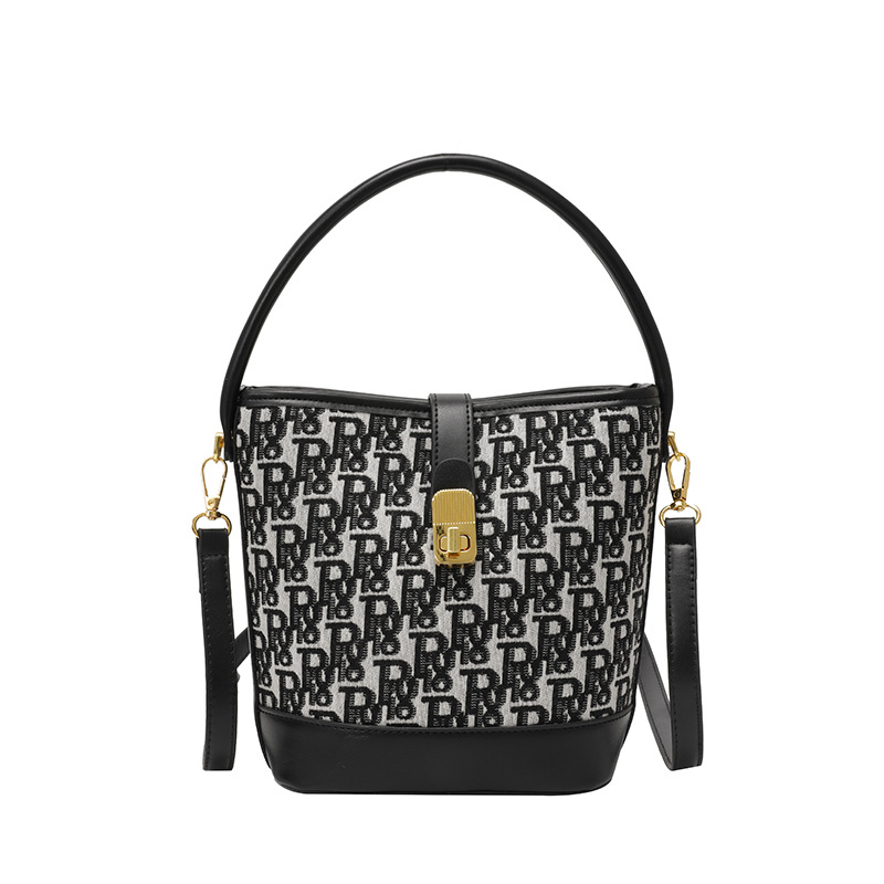 Bolso de mano exquisito de alta gama para mujer 2025 nuevo bolso de cubo retro con estampado de tela bolsa de mensajero de un solo hombro de nicho