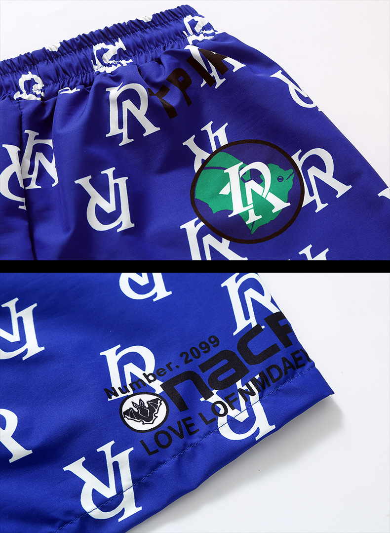 À la mode pour les hommes portent des pantalons de sport décontractés de marque de mode, vêtements de plage, beaux shorts tendance_voghion.com