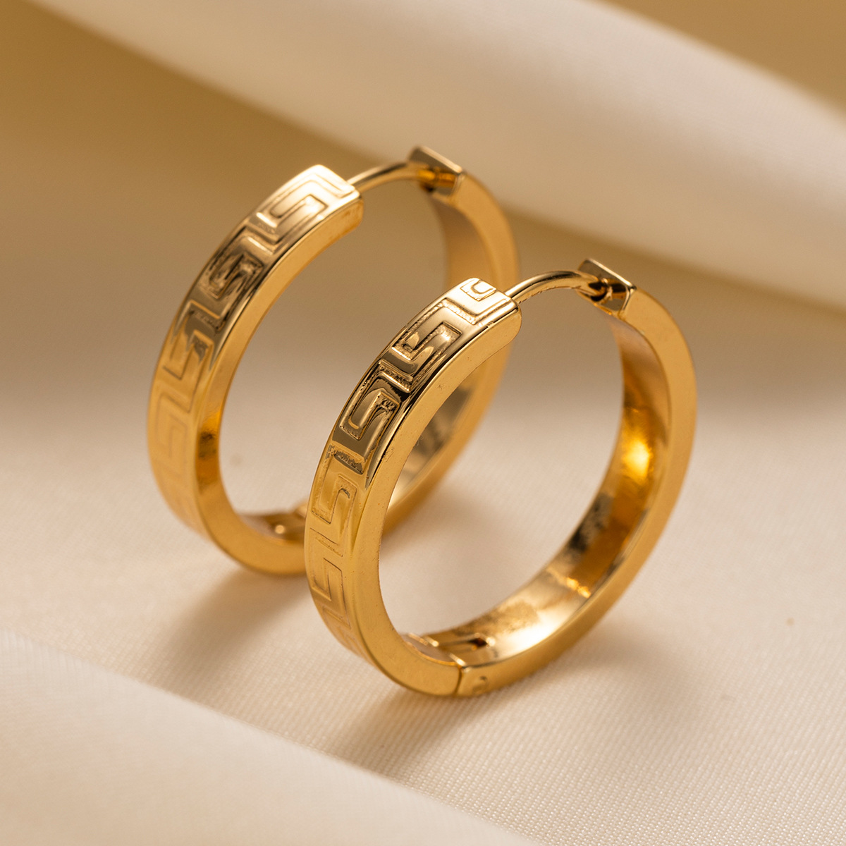 TENA Europa y América pendientes de acero inoxidable vacaciones nicho de diseño de textura de acero de titanio ligero lujo de alta calidad joyas para los oídos