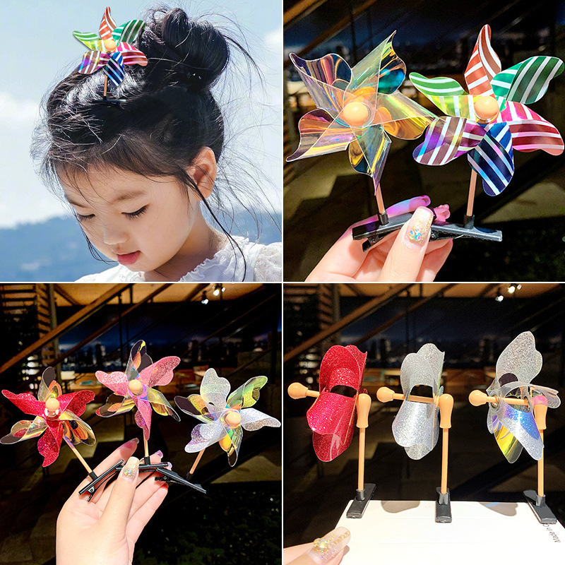 子供の屋外風車のヘアピンのカラーの金色の小さい風車は萌え風車のヘアピンの観光スポットの露店のおもちゃを売ります。|undefined