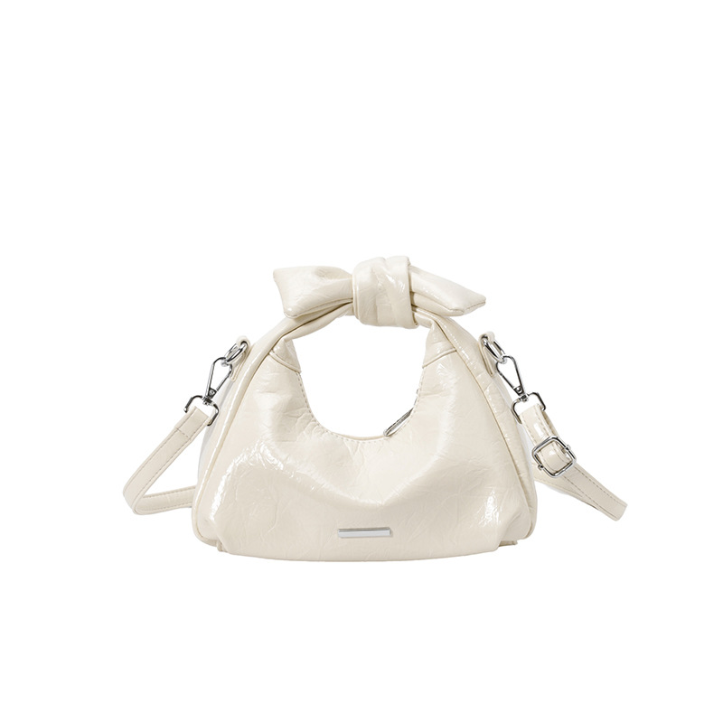 Bolsa de mano de arco para mujeres 2026 nuevo bolso de hombro de moda de verano super caliente sensación diaria mochila de viaje