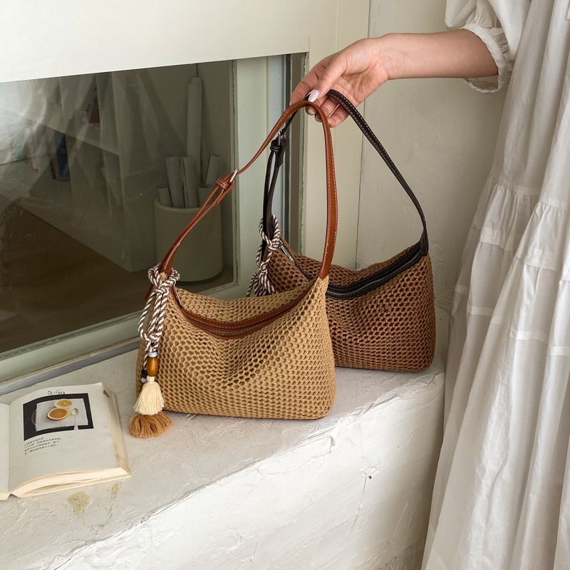 Nuevo verano retro hombro bajo la axila tela de paja bolsas de mujer trampolín oblicuo bolsas de tela de ocio diarias bolsas de playa de vacaciones