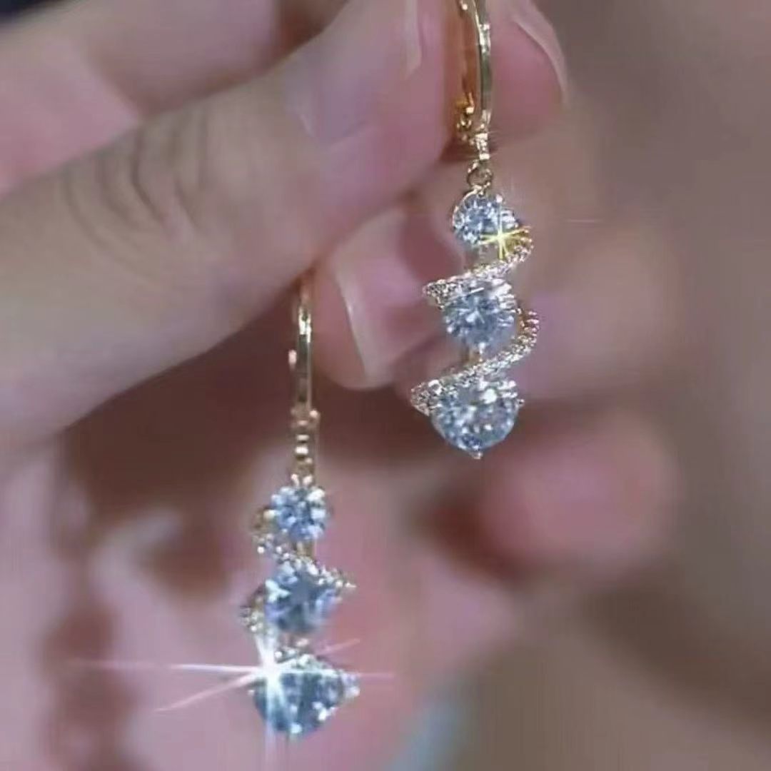 French-style light luxury super shiny twisted tassel earrings for women, with a unique design, high-end feel, and elegant temperament