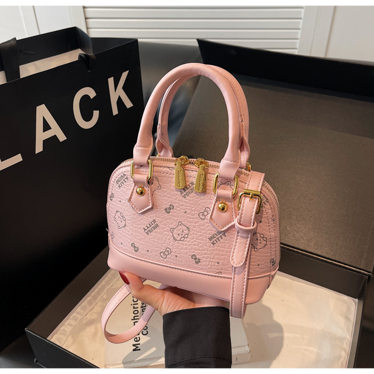 Bolso de mochila para mujeres 2025 textura fresca de alta calidad felina de moda versátil bolso coreano de viaje bolso de hombro