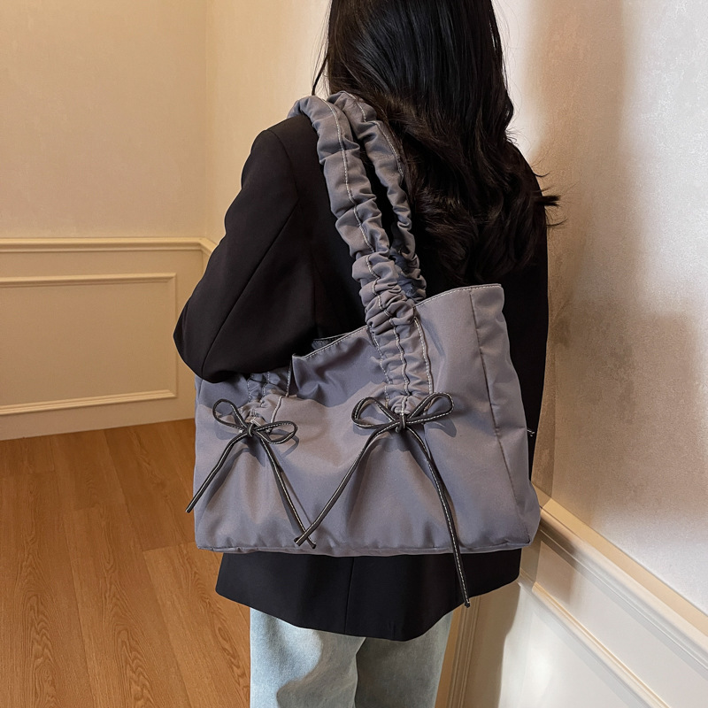 Bolsos de arco de textura de alta calidad, bolsas de nylon de alta capacidad, damas 2025, bolsas de moda, bolsas de nylon casuales de gran capacidad