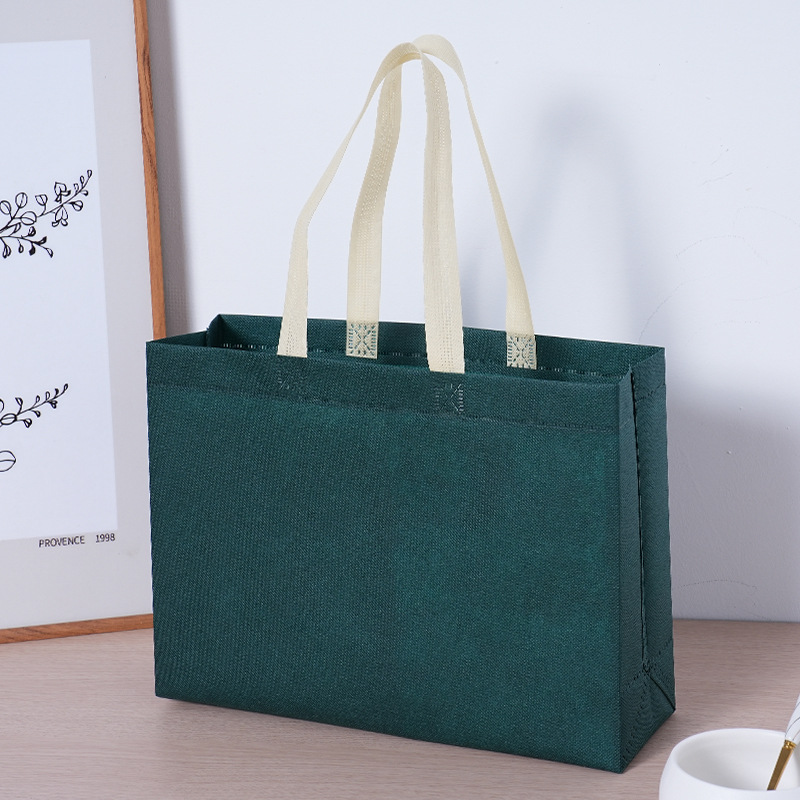 Bolsa de tela no tejida con logotipo impreso bolsa de compras de ropa de protección ambiental bolsa de publicidad corporativa tridimensional