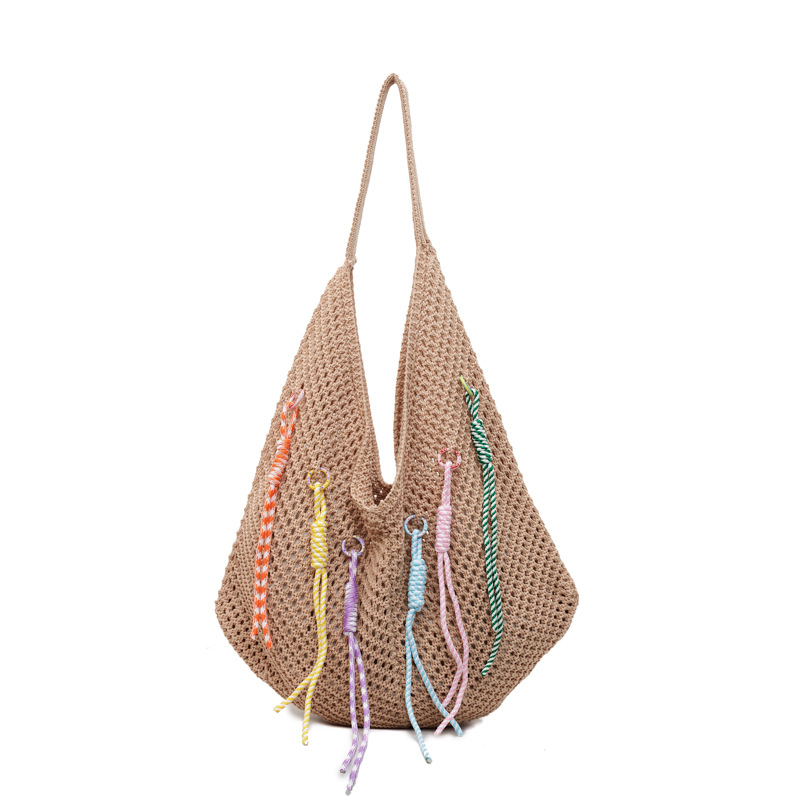 Versión coreana del bolso de nicho 2025 verano nuevo bolso de hombro de punto hueco bolso de mensajero de gran capacidad mujer