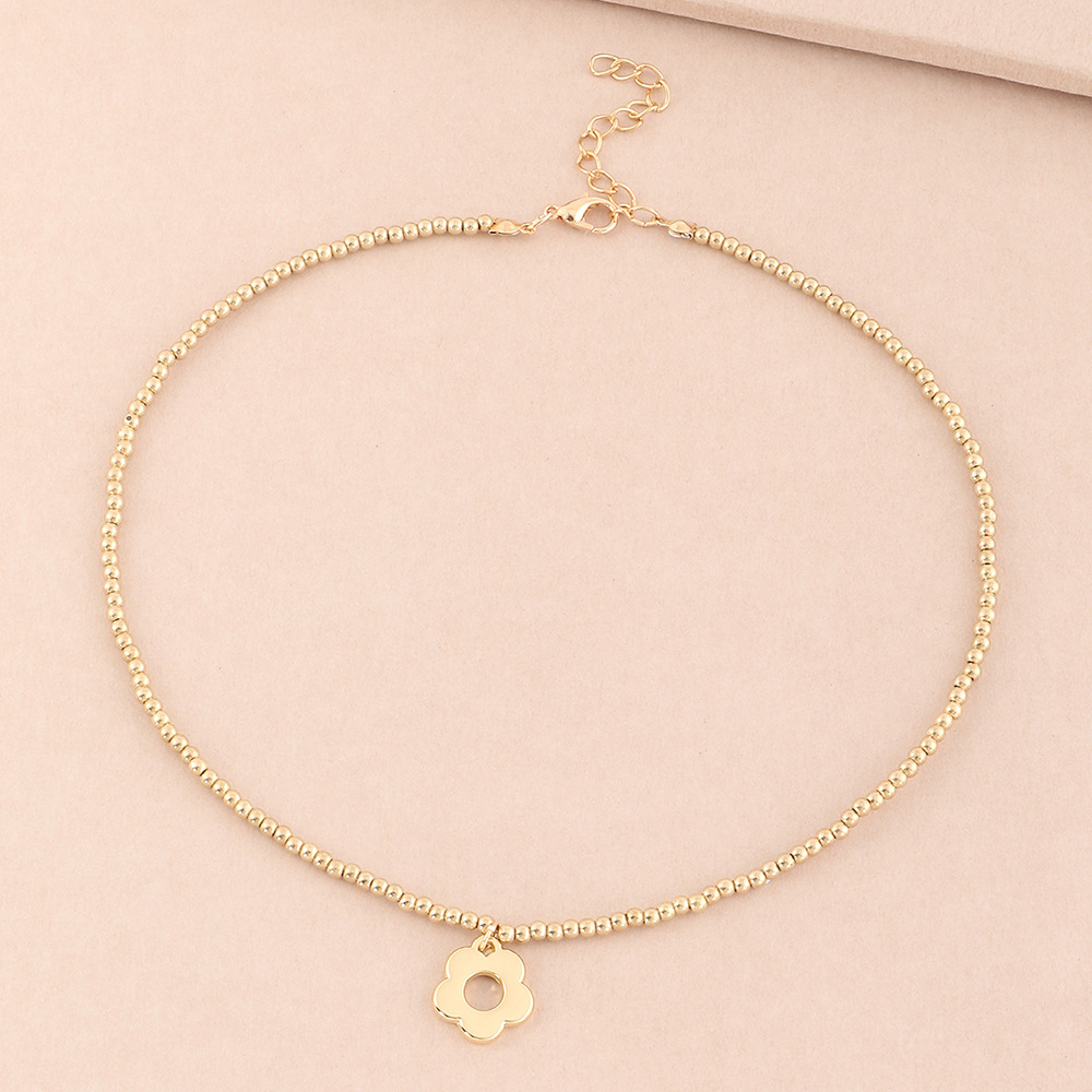 Cute Golden Hollow Flower Bead Alloy Necklace display picture 4