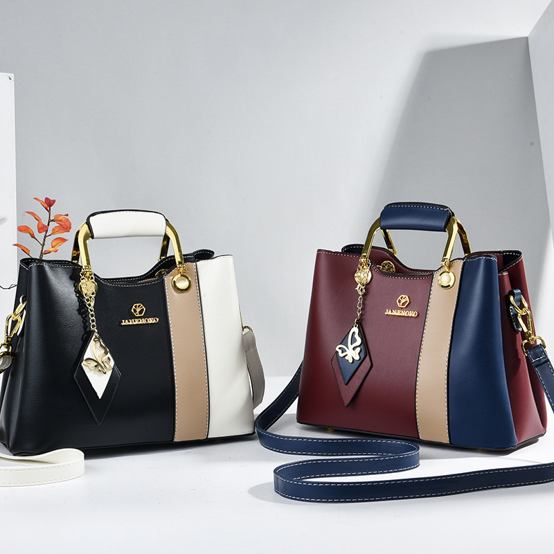 2025 nuevo color contraste bolso de mujer de mediana edad bolso de ropa de cama casual bolso inferior temperamento bolso de madre bolso de hombro portátil