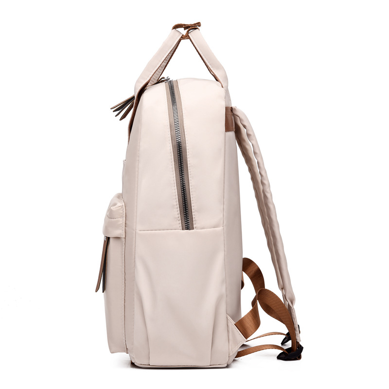 Comercio exterior al por mayor 2023 nueva mochila de nailon súper fuego para mujer, mochila de computadora de gran capacidad de moda para estudiantes