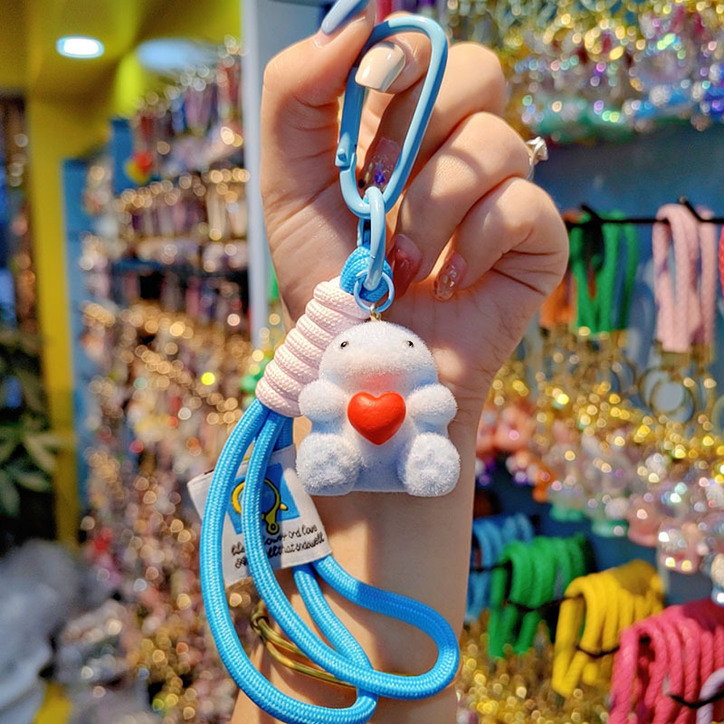 Nuevo caricatura flocado amor Godzilla llavero de moda pareja llavero bolsos de mujer accesorios colgantes de teléfono móvil joyas