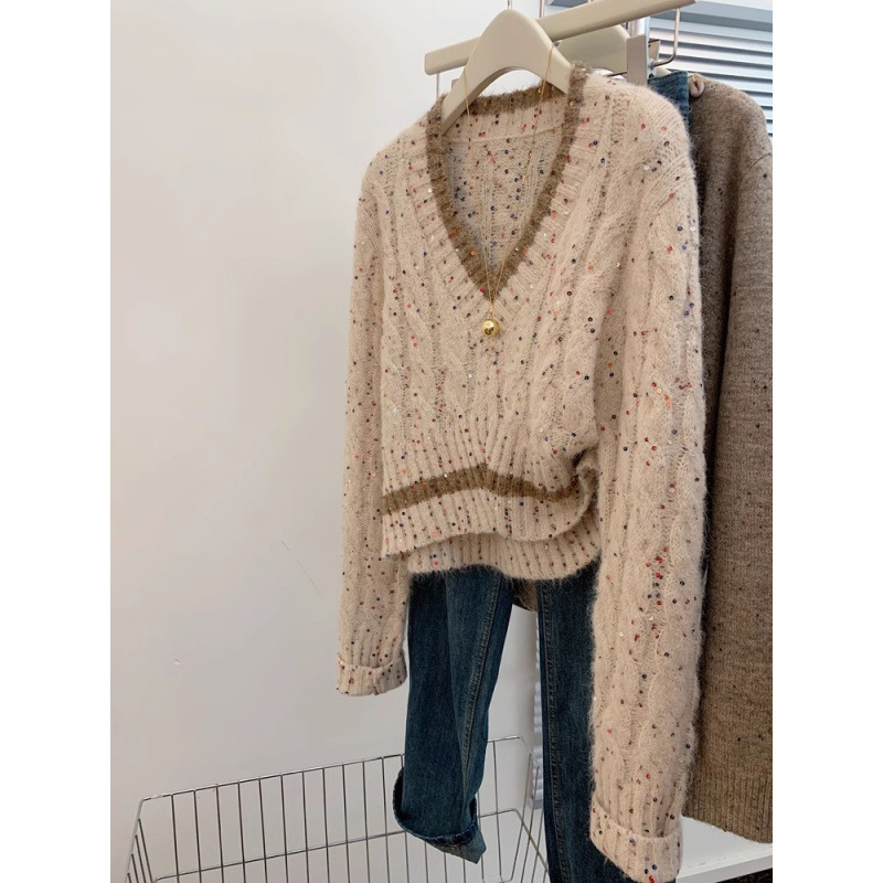 Mujeres coreanas envejecen y cuello alto único manteniendo cálido suéter casual suéter de diseño de otoño y invierno sensación de nicho camiseta de punto