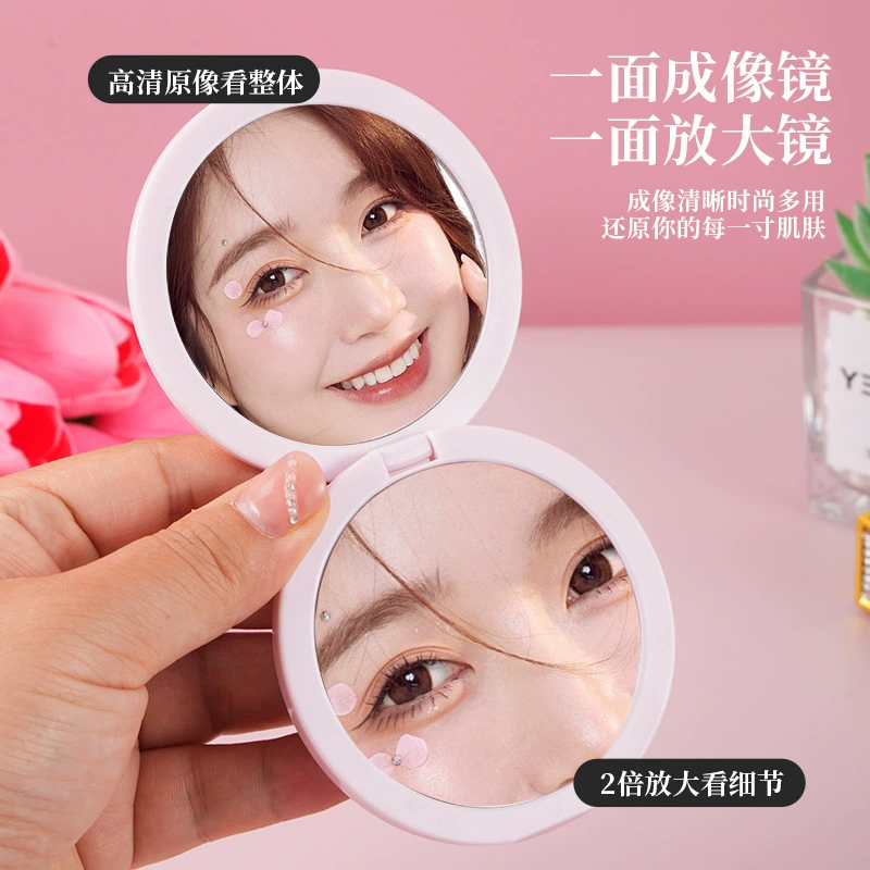 Folding handheld round mirror, double-sided plastic 7.2 cm, magnetic, 2× magnification
