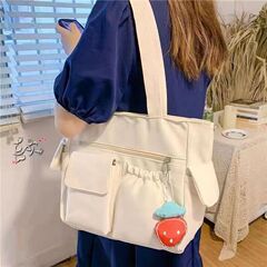 新しいキャンバスバッグの女性ショルダーバッグ日本のシンプルな大容量手提げ袋の小さい方は授業中に学生の補習袋を包んでいます。
