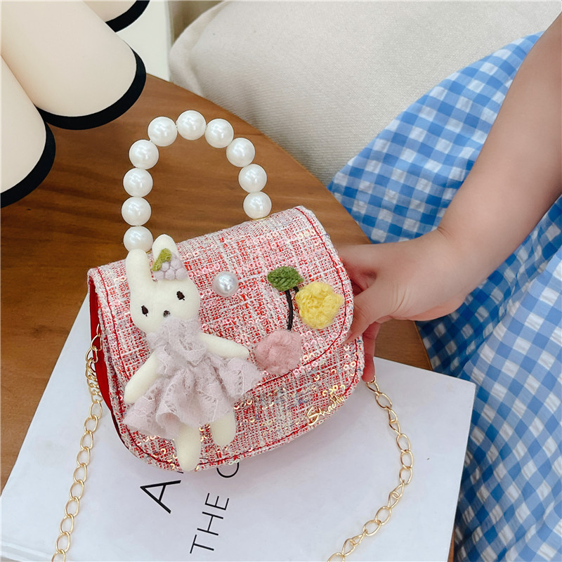 Estilo coreano de los niños bolsa de mensajero estilo occidental princesa bolso de hombro conejo de dibujos animados perla bolso niñas monedero al por mayor