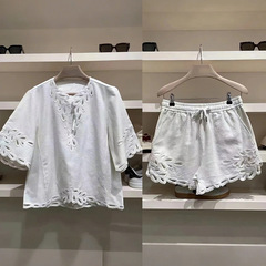 フランス式の小衆2025早春の白い女性のユニークな透かし彫りの刺繍vネックのゆったりした上着の半ズボンセット25037