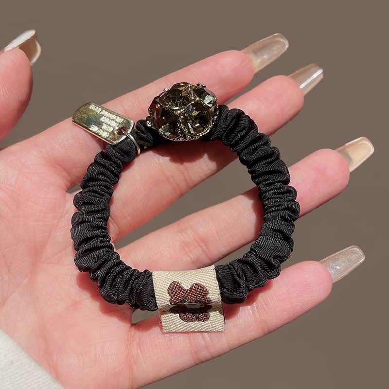 Luxe haarelastiek met strasssteentjes, zeer elastisch en duurzaam, perfect als haaraccessoire voor dames._voghion.com