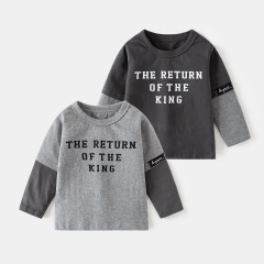 男の子の純綿の長袖のtシャツの秋の服の新型の子供服の赤ちゃんの偽の2枚の底のシャツの上着は代行します。