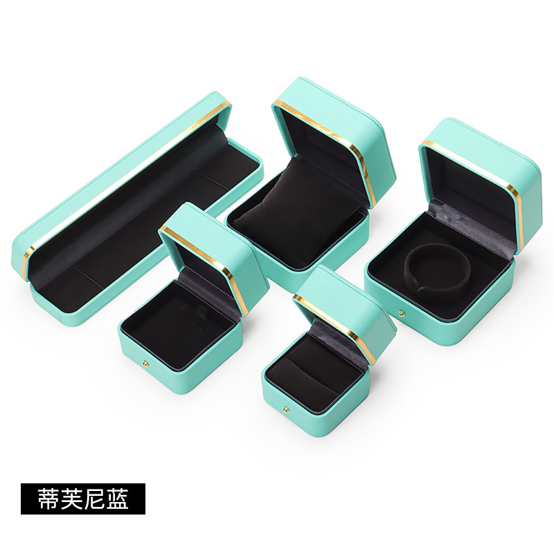 Caja de joyería de cuero de PU de borde dorado redondeado al por mayor caja de regalo de joyería de gama alta caja de reloj caja de joyería colgante de anillo