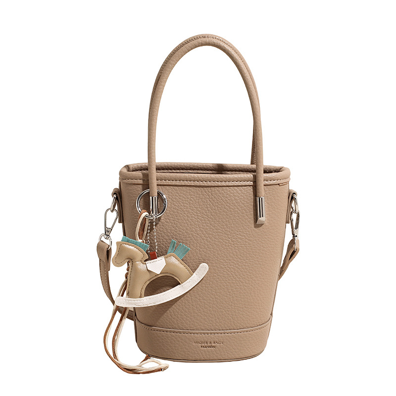 2026 nueva moda versátil bolso de mochila, sensación diaria de lichi, bolso de cubo de agua