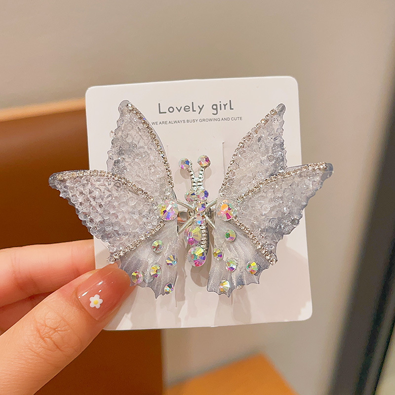 Horquilla de mariposa en movimiento horquilla de diamantes de imitación súper inmortal para niños 2025 nuevo clip de cabello roto lateral de niña accesorios para el cabello