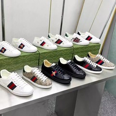 小蜂の本革の白い靴は男女ヨーロッパ駅のカップルです。