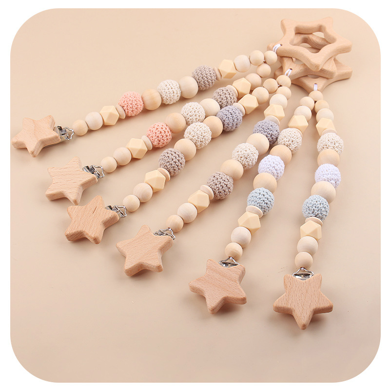 Nuevos productos para bebés abrazaderas de abrazaderas de haz de dibujos animados DIY pulsera de dientes molares decoración colgante de campana cuatro piezas