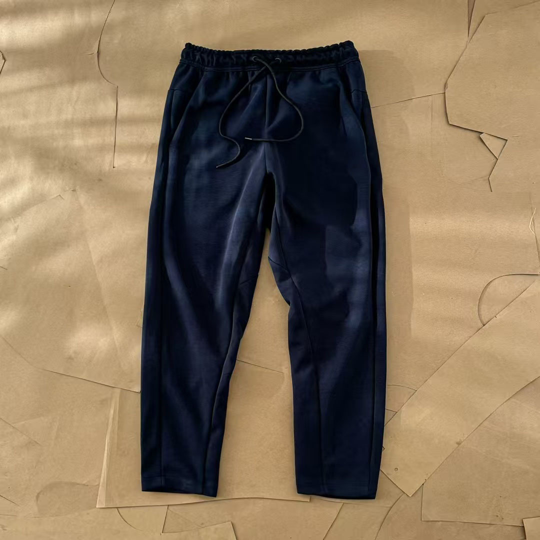 Nuevo hombre deportivo ocio al aire libre versátil punto suelto pantalones largos de piernas largas pantalones 211