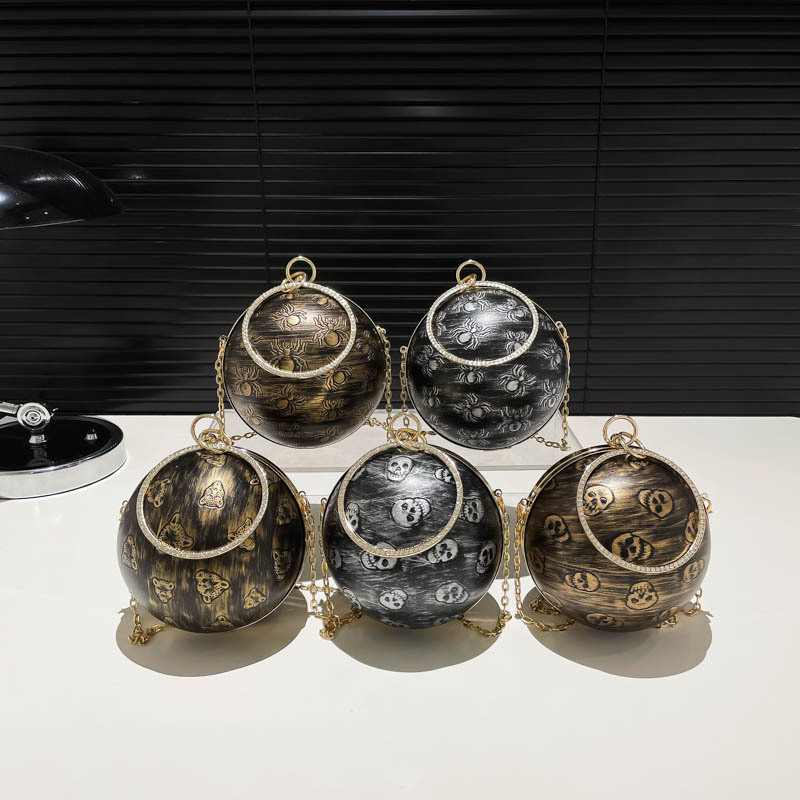 국경 간 레트로 아크릴 휴대용 소형 라운드 가방 여성의 2024 새로운 구형 두개골 양각 립스틱 헤드폰 어깨 가방