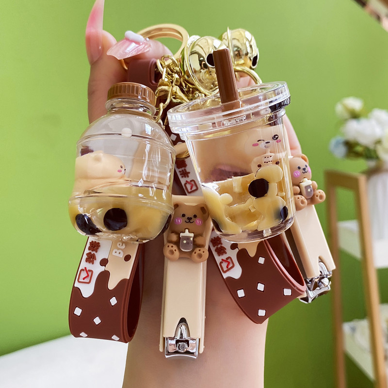 Creative cartoon oil floating bear Milk Tea Cup key chain exquisite car key chain schoolbag small pendant wholesale