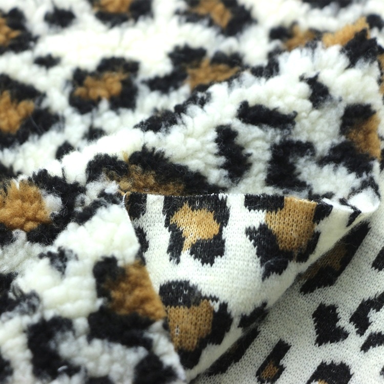 色织提花羊羔毛绒布全涤仿毛皮加厚颗粒泰迪绒豹纹提花羊羔绒布料