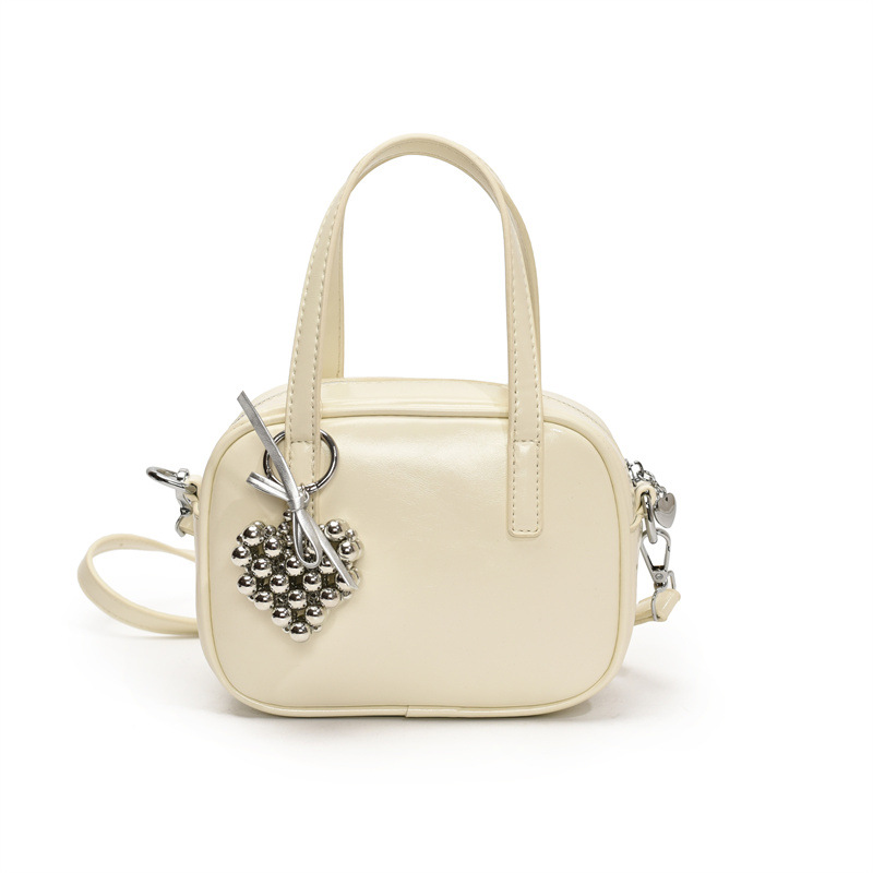 Bolsos populares de este año 2025 primavera nuevo bolso femenino con cuentas de amor bolso de hombro pequeño bolso de mensajero de color de contraste fresco