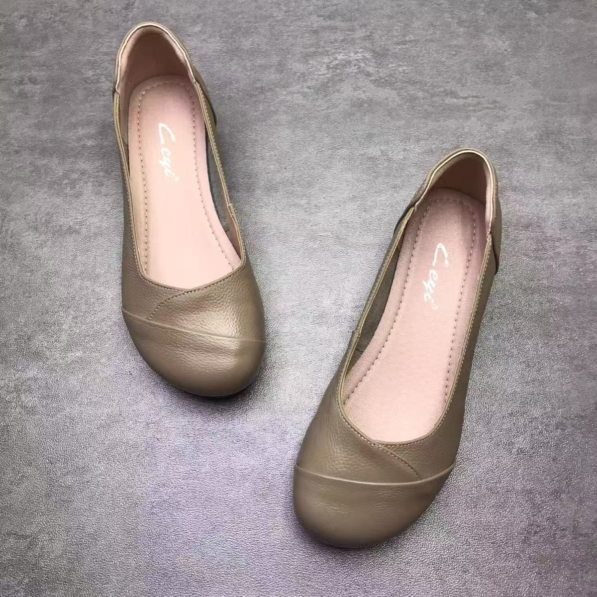 2026 primavera y verano nuevo estilo de cabeza redonda perezoso un pie de pie de boca plana no se cansa de pie zapatos de moda de cuero pequeño