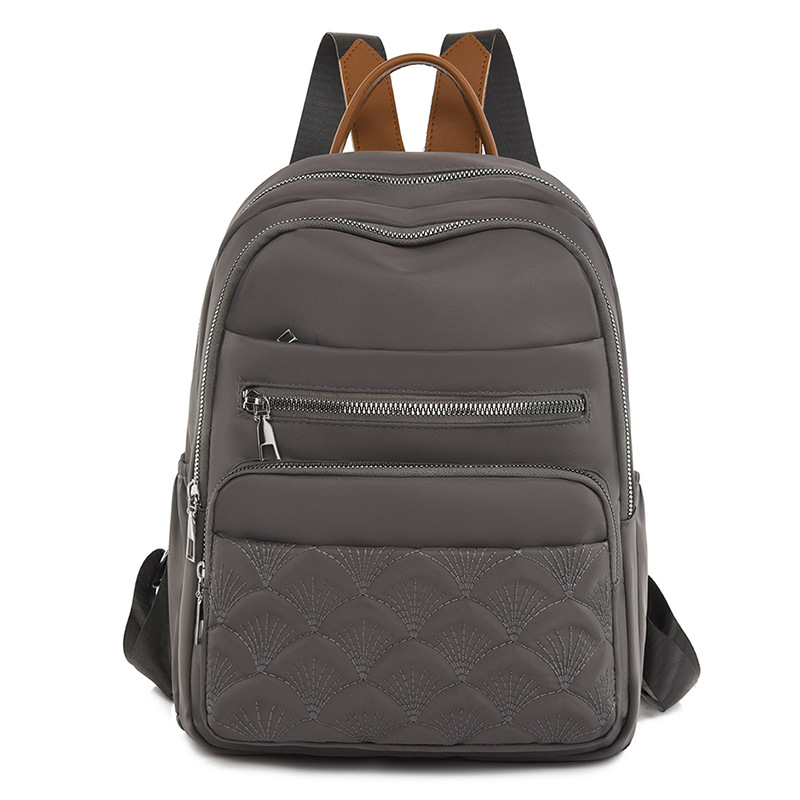 Comercio exterior al por mayor 2023 nueva mochila de tela Oxford para mujer retro casual, bordado de moda, mochila de viaje ligera