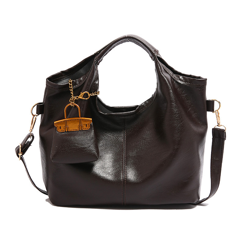 Bolsa de cubo retro 2024 nueva bolsa de hombro de gran capacidad, bolso de nicho elegante, bolso de cuero suave