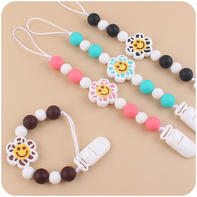 Nuevo bebé suministros de dibujos animados flor mordedor creativo bebé lindo silicona mordedura chupete cadena anti-gota cadena