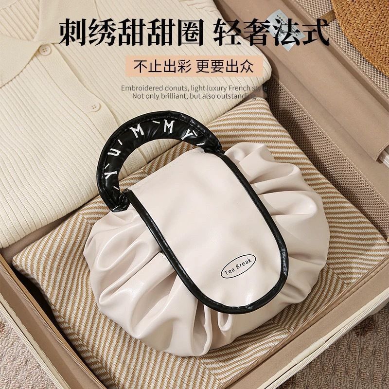 Perezoso 2025 nuevo paquete de maquillaje impermeable de gran capacidad portátil bolsa de almacenamiento de viaje cuerda de bombeo para lavar