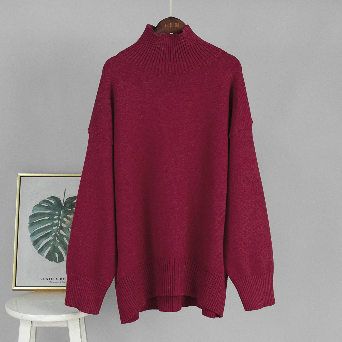 Suéter de cuello alto transfronterizo para mujeres 2025, Europa y los Estados Unidos de otoño y invierno explosivo color sólido jersey de punto de cuello alto suéter suelto para mujeres