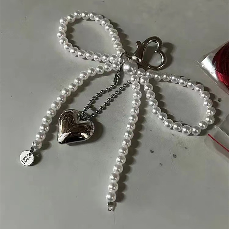 Elegant and fashionable bow artificial pearl love pendant mobile phone chain versatile exquisite small gift bags with ornaments