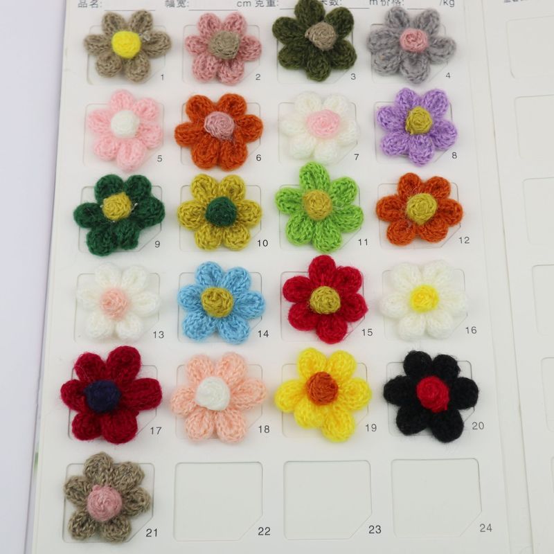 現物はカラーの編み花を提供しています。|undefined