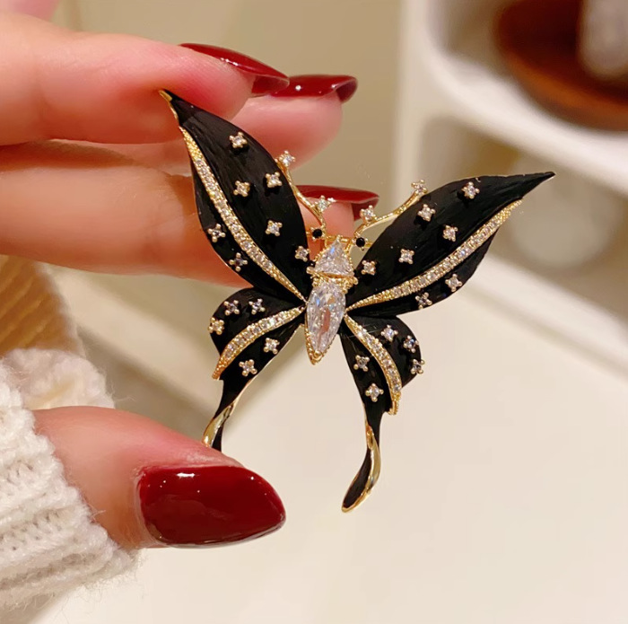 Black elite brooch
