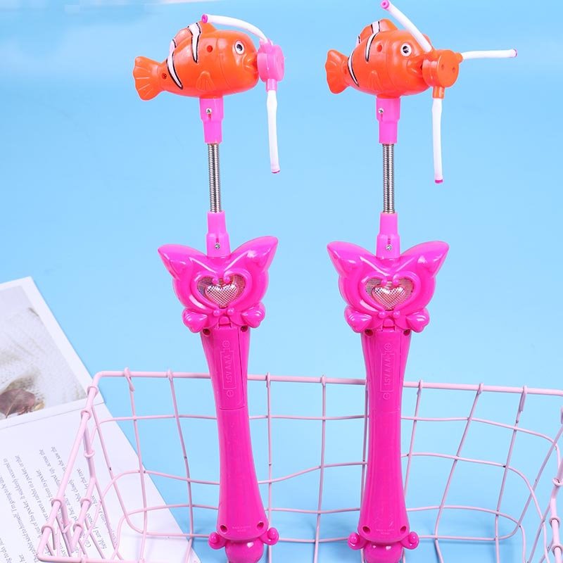 Molino de viento de cabeza de pescado luminoso giratorio de mano para niños palo de luz nocturna palo de flash de música molino de viento de pescado barraca de juguetes para niños lote