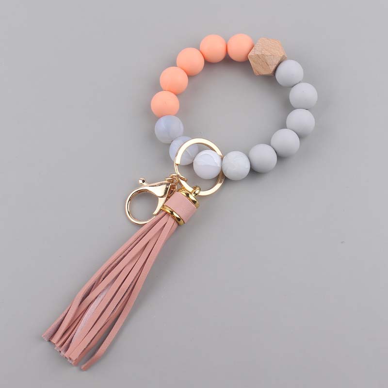 Nuevo cuero creativo pu borla colgante silicona muñeca llavero colgante silicona cuentas pulsera llavero